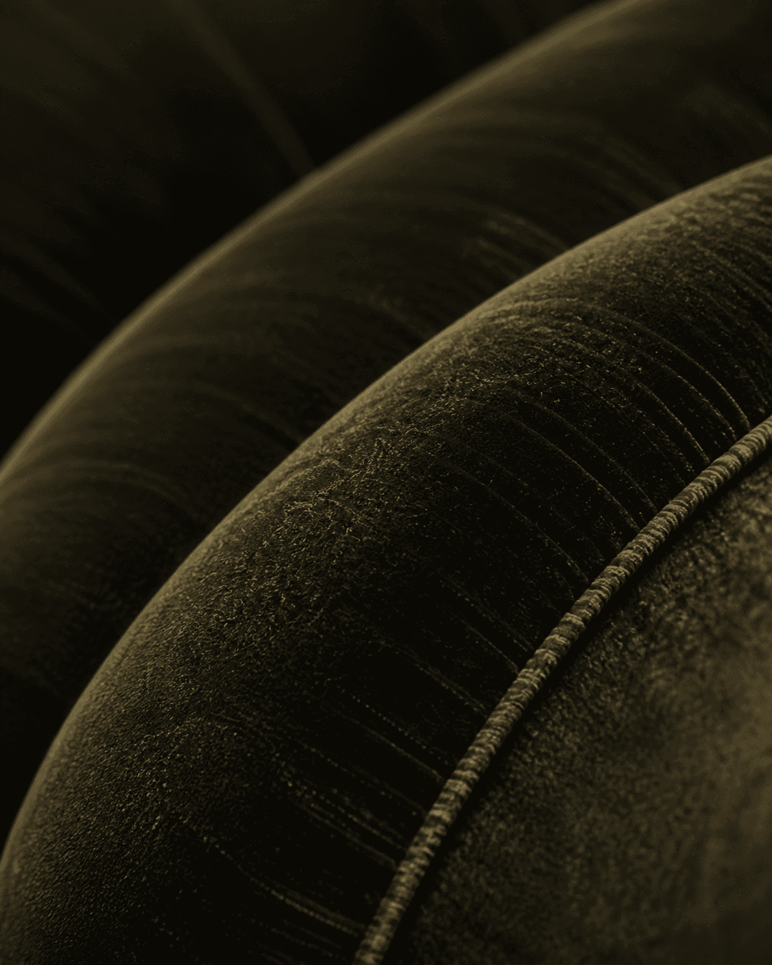Close detail of tailored olive velvet upholstery